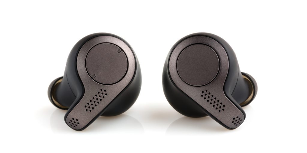 Black wireless in ear headphones with a white background