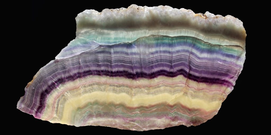 Rainbow Fluorite banded with blue, purple, green, clear, and yellow colors